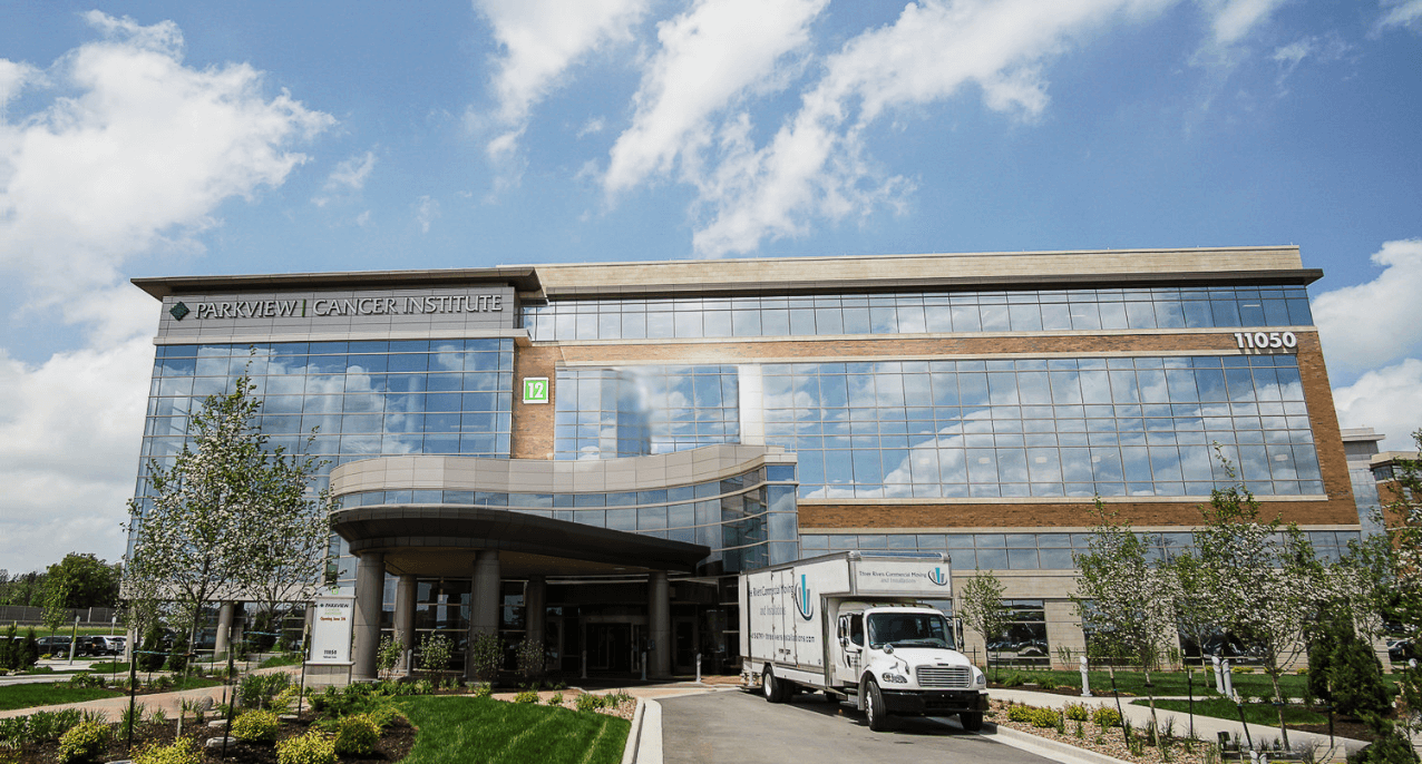 Parkview Medical Center Portrait Photo on a bright sunny day with a Large White Box Moving Truck parked in front to showcase Three Rivers Office Moving Services